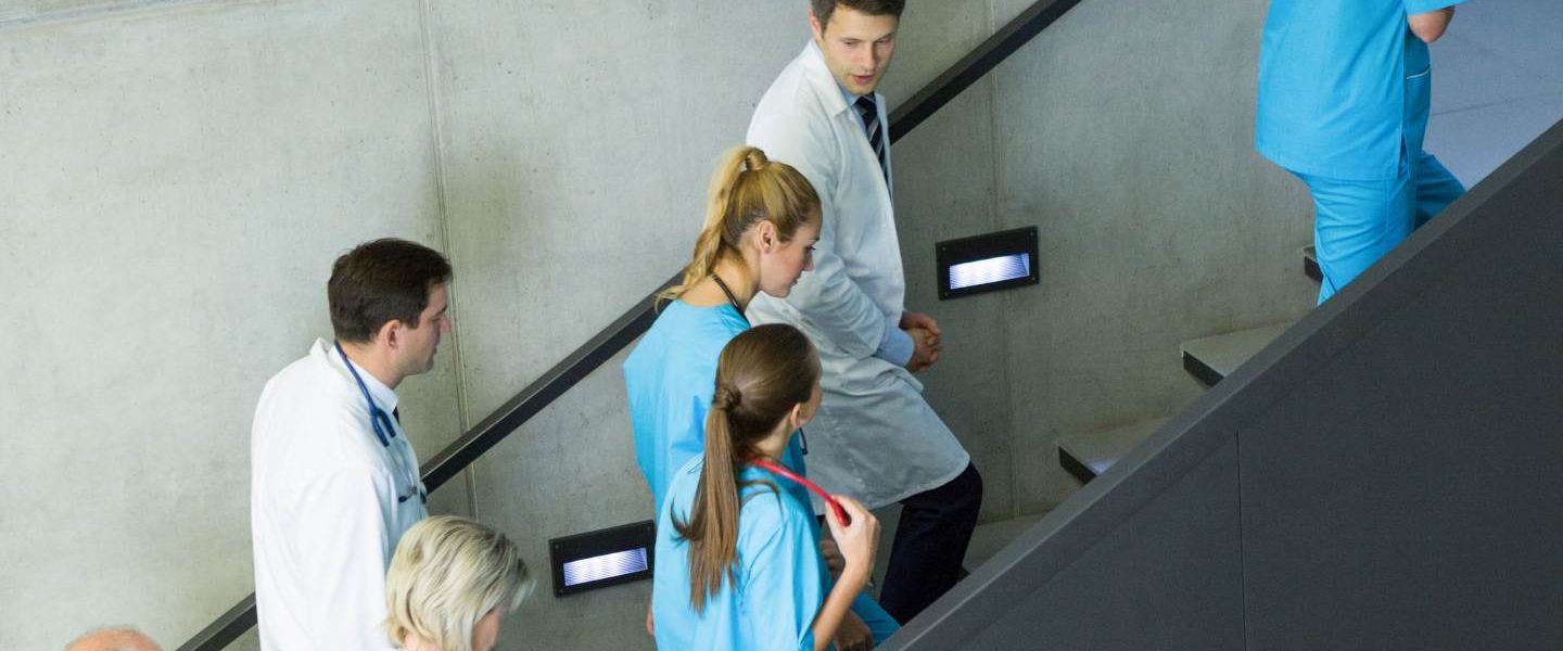 Lena Lighting doctors on stairs